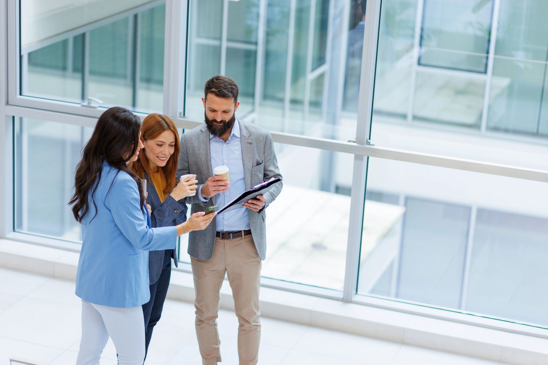 Business professionals reviewing plans in a modern office